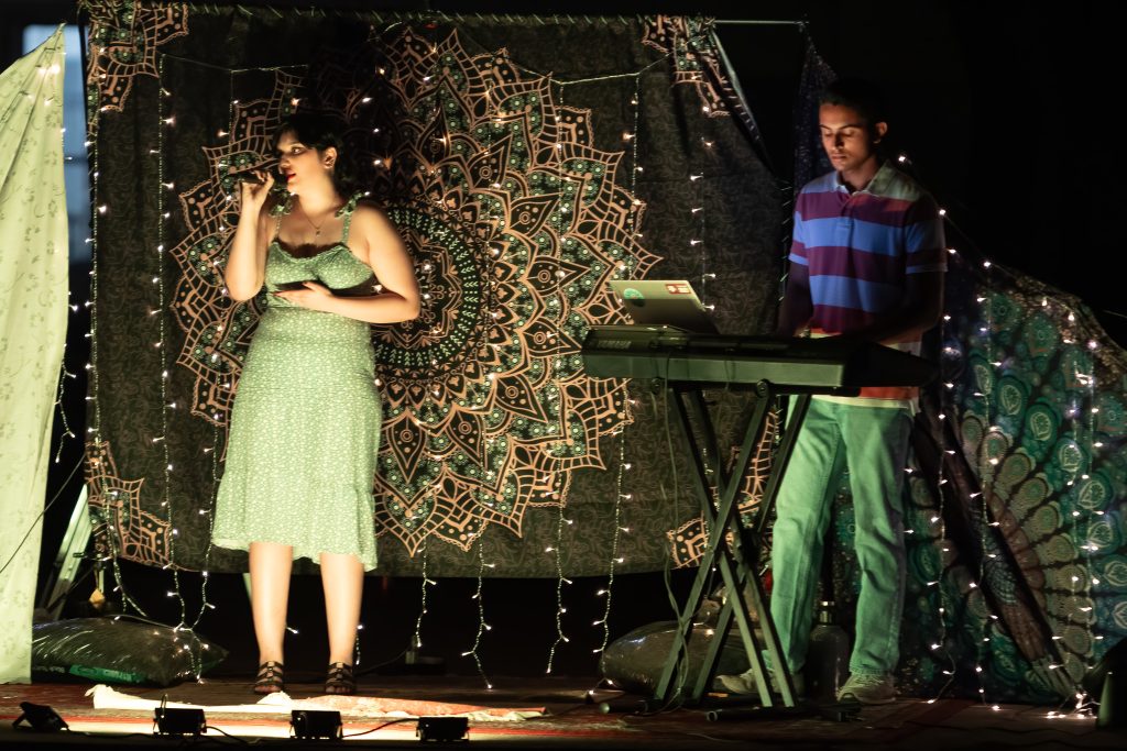 A student performing on stage at Staging Success an event celebrating the arts