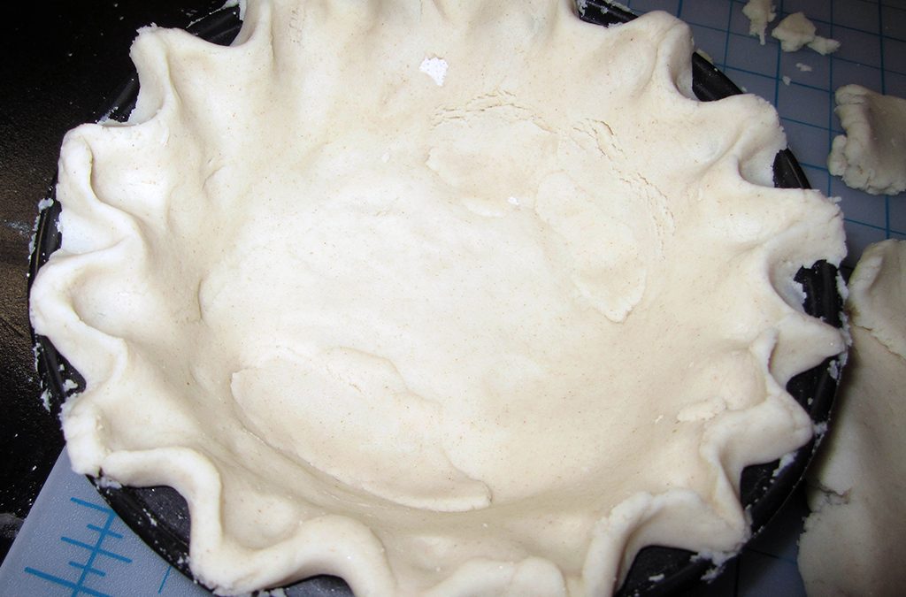 Press the salt dough mixture into the bottom of a pie pan, and flute the edges. Remove it from the oven when the dough is white and dry.