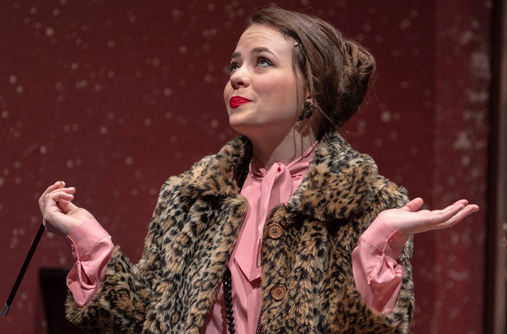 Audrey Burgoon as Miss Scarlet in Salina Central High School's production of Clue.