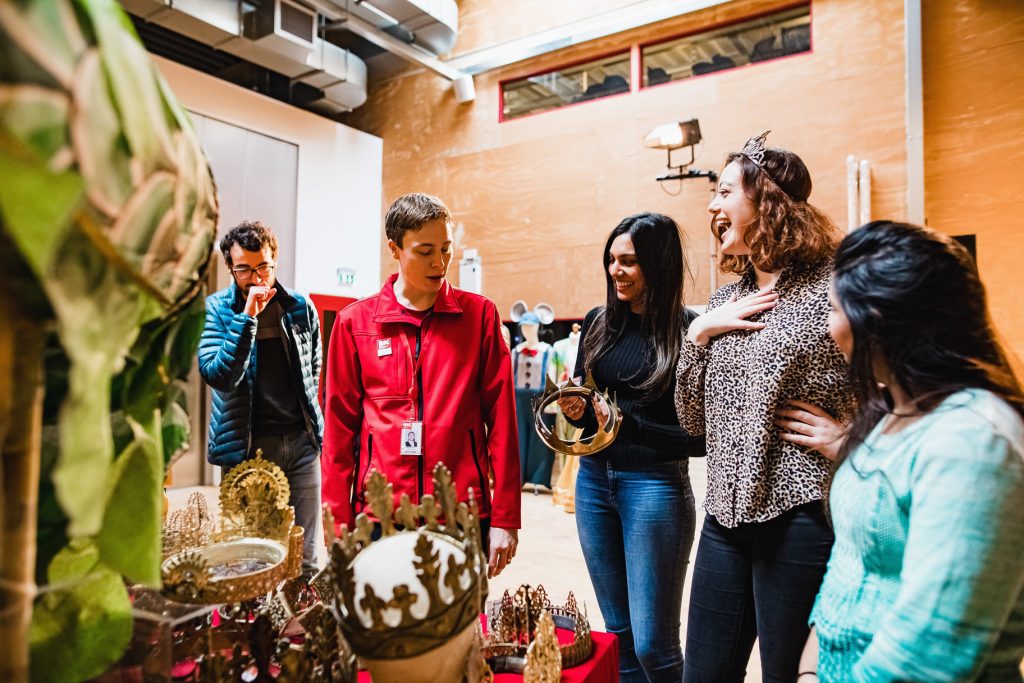 Students explore the costume closet at the Royal Shakespeare Company.