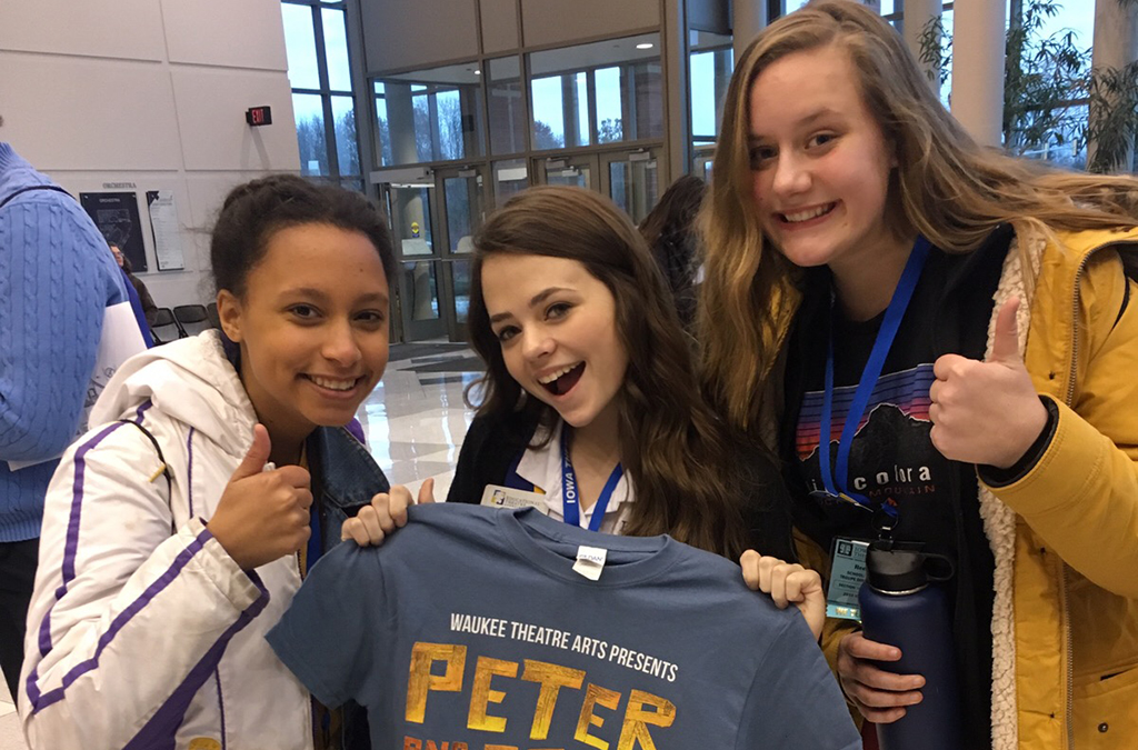 Burgoon (center) makes new friends at the Iowa Thespian Festival.