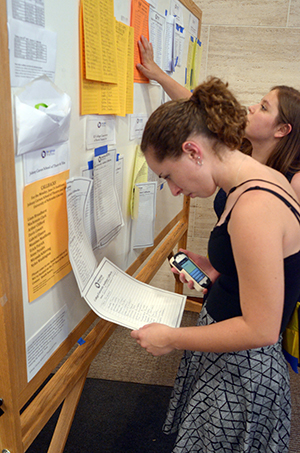 Students check the callboard at the International Thespian Festival.
