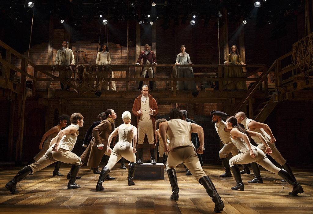 Lin-Manuel Miranda (center) and the company of Hamilton.