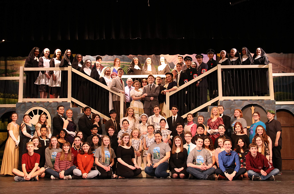 Sophia Hillman (front center, with the team for The Sound of Music, says directing is her second favorite theatre activity.
