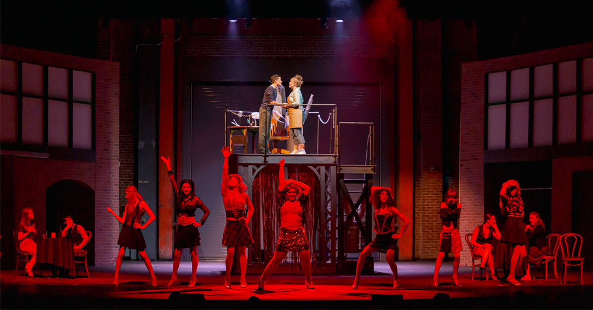 Students performing Kinky Boots at ITF, showcasing the elements of stage lighting.
