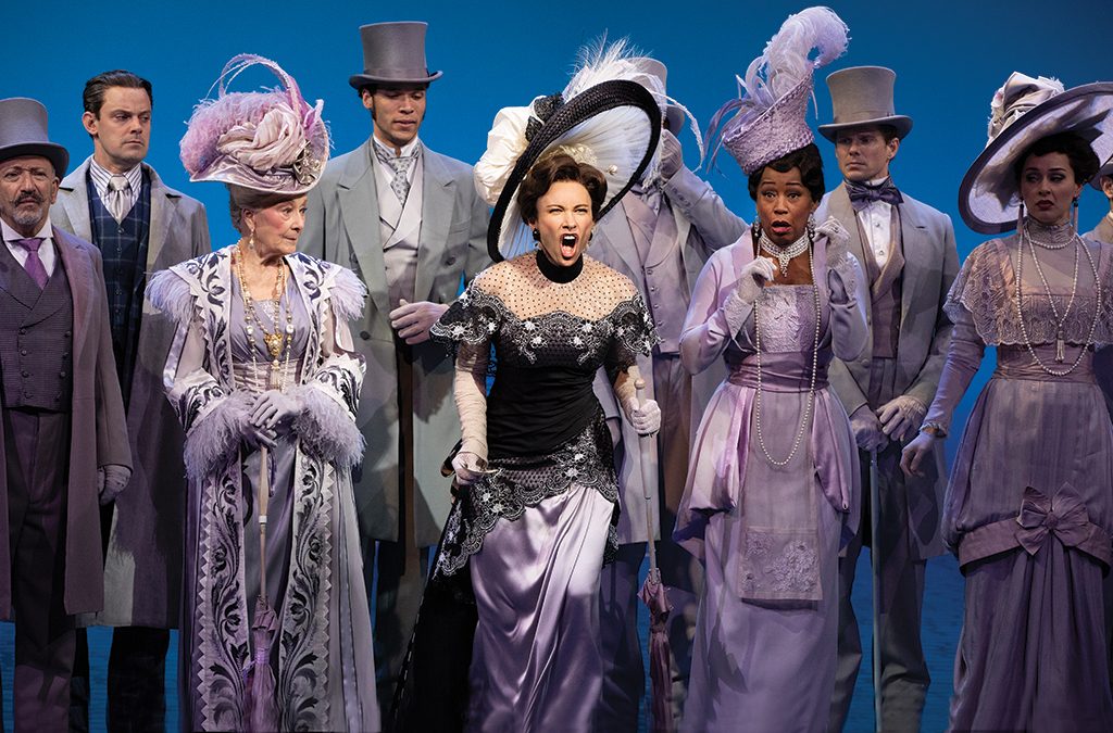 Laura Benanti (center) as Eliza Doolittle loses her ladylike composure at the Ascot race in Lincoln Center Theater's production of My Fair Lady.