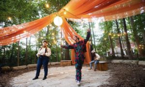 young people in theatre costumes on outdoor stage