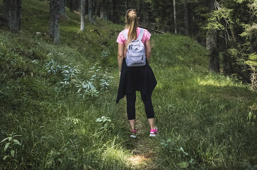 Girl walking in woods