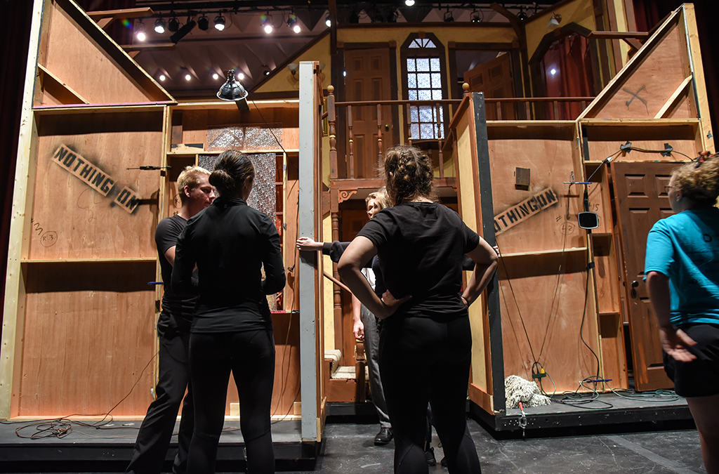 Running crew members from McPherson (Kan.) High School load in the set for their production of Noises Off.
