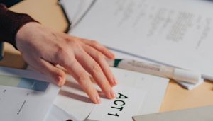 playwriting tips hand on paper