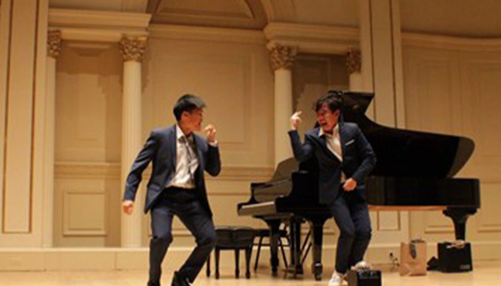 Two young men dancing next to a piano at Carnegie Hall