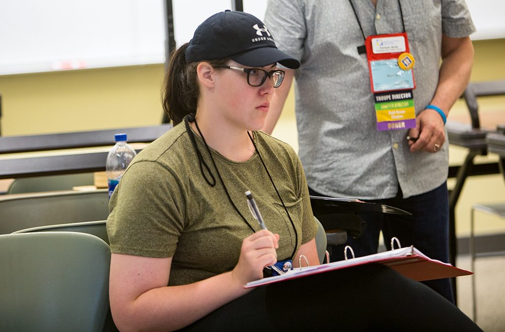 A stage manager takes notes during rehearsal for the Thespian Playworks program at the 2019 International Thespian Festival.
