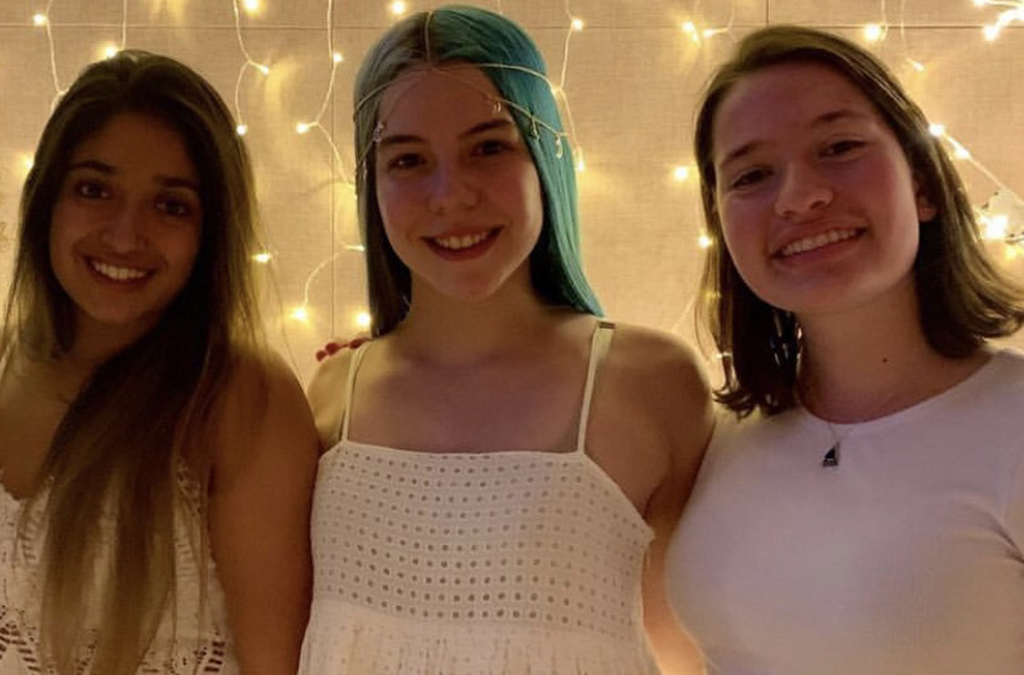 Samantha Squires (center) with her friends Sanchi Engineer and Raye Myers the night before her high school graduation.