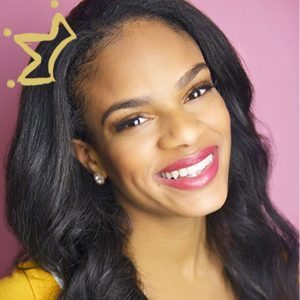 young Black woman in yellow shirt against pink background