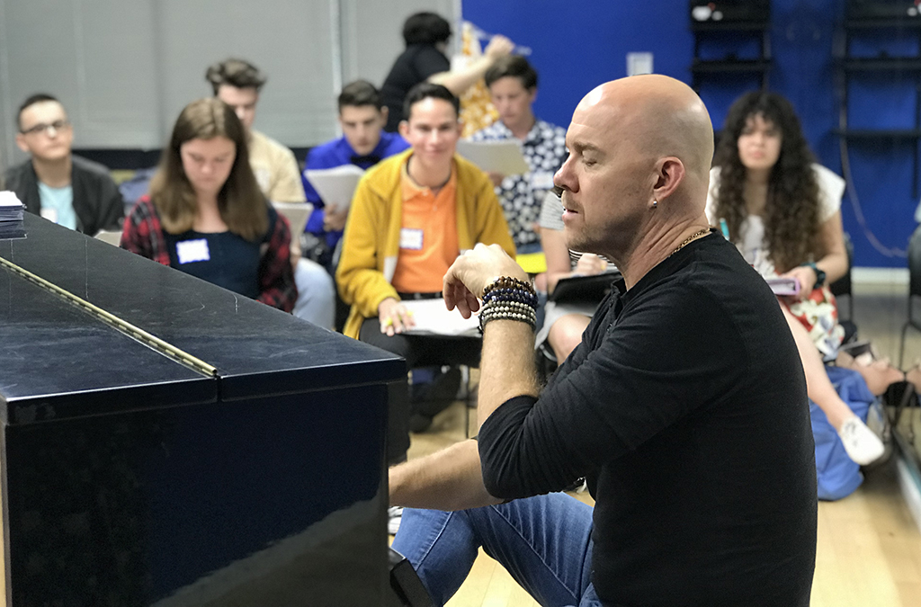 Music director Todd Schroeder rehearses the California Thespian cast.
