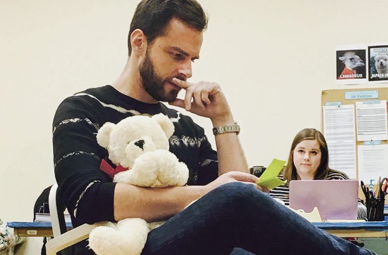 Playwright Eric Ulloa sorts through letters as a volunteer at Healing Newtown.