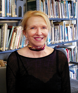 Catherine Zuber in her studio library.