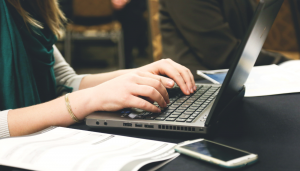 Woman writing laptop